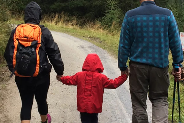 Family with small child on a hike in the rain | SungateKids | Child Abuse Awareness, Support & Advocacy