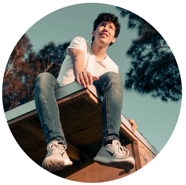 Teenaged boy sitting on edge of deck | SungateKids | Child Abuse Awareness, Support & Advocacy
